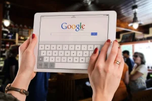 Google search on laptop screen desk setup