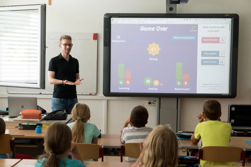 eacher using digital tools and smartboard to enhance classroom learning experience
